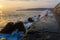 Stone tetrapods on the seashore in which the waves break.