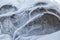 Stone texture in snow and ice. Mountain wall. Rock texture.