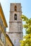 Stone tower of Cathedral of Our Lady of Le Puy in old town quarter of perfumery city of Grasse in France