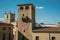 Stone tower and gothic steeple church at Caceres