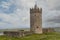 Stone tower and walls of Doonagore Castle, county Clare, Ireland. Stunning example of old stronghold. Irish history. Popular