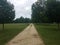 Stone trail with grass and trees