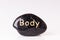 Stone treatment. Black massaging stones on a white background. Hot stones. Balance. Zen like concepts. Basalt stones.