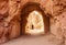 a stone tunnel with a doorway