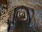 Stone Tunnel entrance carved into mountain - Caminito del Rey, Spain