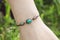Stone tyrkys pendant bead bracelet on female wrist