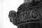 Stone vase with decor, black and white photo. Fragment with a satyr head. Hermitage collection