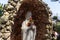 The stone Virgin Mary statue in the garden of the Deir Al-Mukhraqa Carmelite Monastery in northern Israel