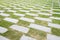 Stone walkway pattern on a grass field in perspective view