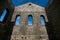 Stone Wall of Ancient Church Ruins with Gothic Windows