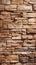 Stone wall brick background featuring a seamless pattern of sandstone facade