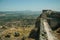 Stone wall from the castle on hill covered by rocks at Monsanto