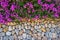 Stone wall decorated with bougainvillea