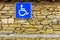 Stone wall and disabled access Sign, handicap accessible sign