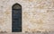 Stone Wall with Door and Oriental Engraving.