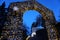 Stone wall at the entrance to the Trsat Castle in the Croatian city of Rijeka decorated during the Advent with Christmas lights