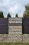 Stone wall-gabions. An unusual and and attractive type of house fencing