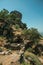 Stone wall on hilly landscape covered by rocks in Monsanto