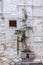 Stone wall of a house with metal hatches