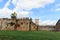 Stone wall with the lion gate Porta del Leone at Piazza dei Miracoli place in Pisa, Tuscany, Italy