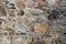 Stone wall made of stones of various shapes and colors