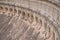 Stone wall of the old dam. Beautiful brickwork with arches and pillars.