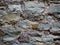 Stone wall of an old house of rocks, old masonry. Texture, stonework