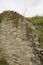 Stone wall of ruins made of different materials