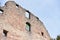 Stone wall ruins of an old castle of Schloss Neuenburg in Germany, against a blue sky with text space