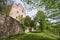 Stone wall of the ruins of an old castle of Schloss Neuenburg in Germany, overgrown with ivy, in spring.