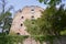 Stone wall of the ruins of an old castle of Schloss Neuenburg in Germany, overgrown with ivy, in spring.