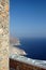 Stone wall by sea rocky coastline greek islands