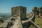 Stone wall and square tower on hilltop at the Castle of Monsanto