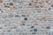 Stone wall texture background. Old stonewall traditional pattern building facade, natural material