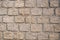 Stone wall texture: brown, orange, terracotta. Stone blocks.  Brown brick wall seamless background