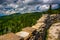 Stone wall and view of the Blue Ridge from Devils Courthouse, ne