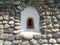 The stone wall and the window of a building - at Barsana orthodox monastery