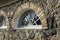 Stone wall with windows made of stones of various shapes and colors