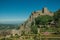 Stone walls and tower of Castle over hill near garden at Marvao