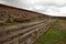 Stone walls uncovered by archaeologists at the Puma Punku, a UNESCO world heritage site. Tiwanaku, Bolivia