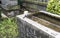 Stone water basin and ladle at Shinto shrine in Tokyo, Japan