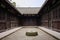 Stone well in courtyard of ancient Chinese dwelling building