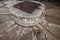 Stone well with rusted metal lattice