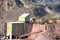 Stonecrusher machine in an active quarry mine of porphyry rocks.