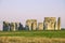 Stonehenge, famous landmark, standing stones of Stonehenge in Wiltshire, England. Sunlight, Clear sky, green grass, no people.