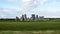 Stonehenge prehistoric monument, green grass, blue sky and clouds, panoramic view - Wiltshire, Salisbury, England