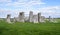 Stonehenge prehistoric monument, green grass, blue sky and clouds - Wiltshire, Salisbury, England