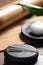 Stones with acupuncture needles on wooden table