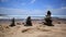 Stones balance on beach. Blue sky. Picturesque sea landscape. Tenerife. Ocean. Sea waves.