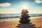 Stones balance on the beach during sunrise. Zen meditation.